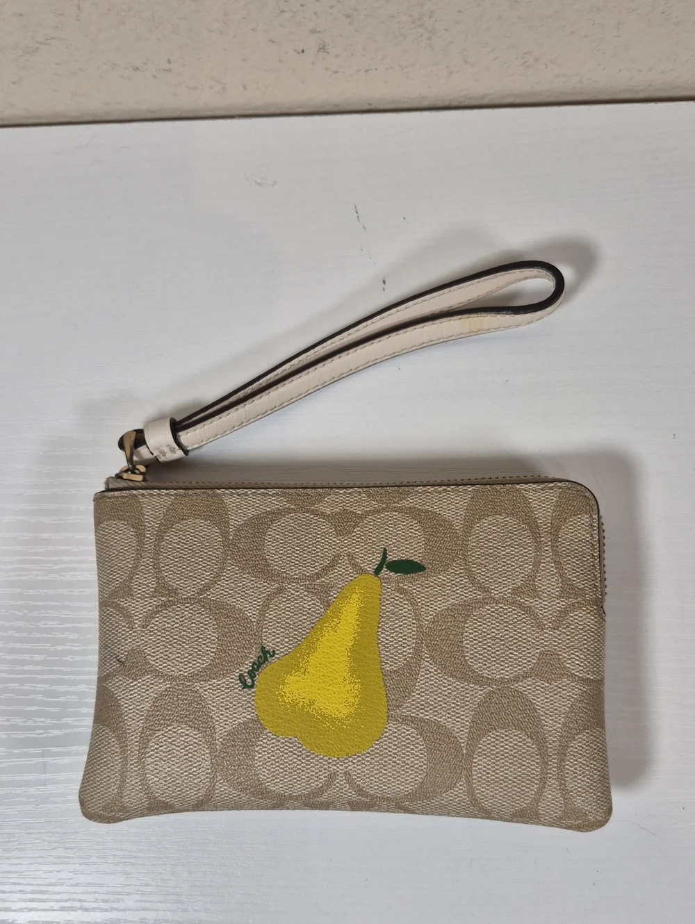 Coach Corner Zip Wristlet In Signature Canvas With Pear
